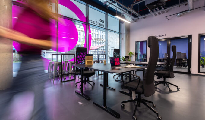 Woman walking out of room. Coworking, hot desk and meeting rooms in central Dortmund.