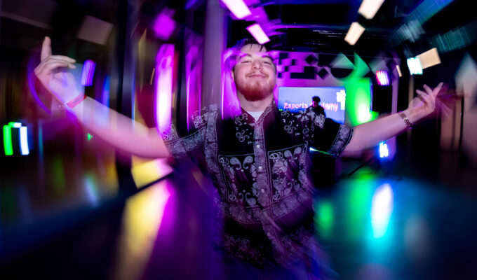 Man dancing on dance floor at Basestack Café & Bar in Dortmund