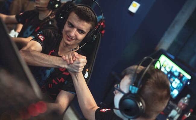 Gamers shaking hands while playing.