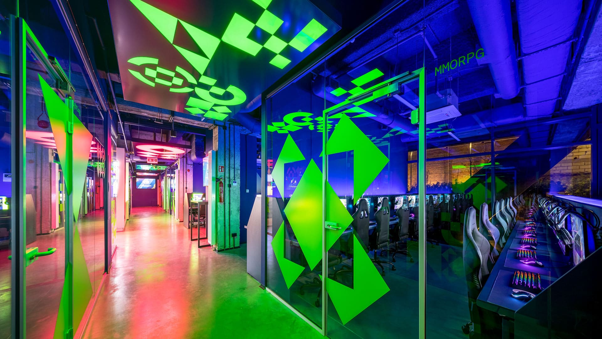 Basestack hallway and glass walls with neon blue, green and red colors.