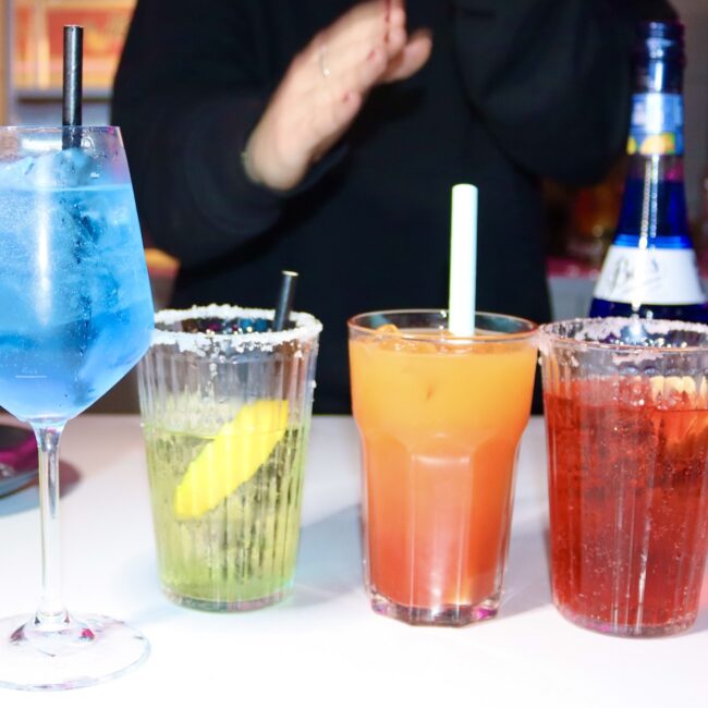 4 colourful cocktails at bar in Łódź