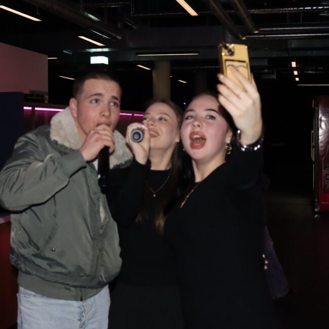 Group singing Karaoke in Łódź bar at BaseStack