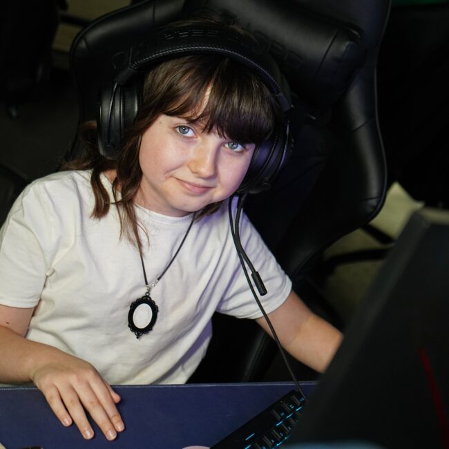 Girl playing Fortnite , CS2, CS:GO, League of Legends, Minecraft as Esports café in Łódź